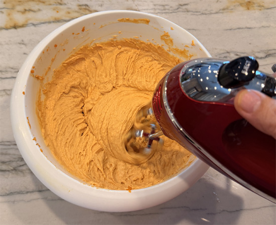 In a large bowl, stir together the yogurt, pumpkin, whipped topping, pudding mix, pumpkin pie spice, and caramel syrup until smooth and completely combined, with no streaks of whipped topping left.