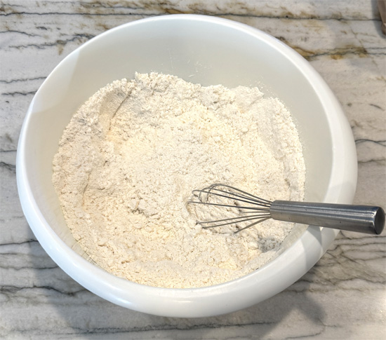 In a large bowl, whisk together the cake mix, Jell-O black cherry powder, and protein powder.