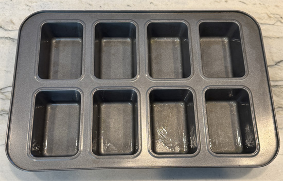 Lightly grease 12 mini loaf pans with avocado oil. Divide the batter evenly among the pans.