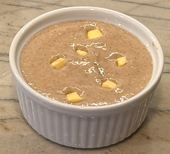 Add butter and bake: Cut the cold butter into small chunks and press it into the top of the batter.