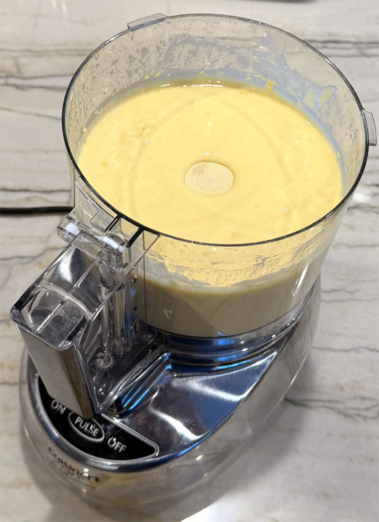 Put the cake mix, protein powder, egg whites, whole egg, avocado oil, water and lemon into a blender and mix until smooth. 