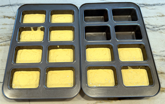 Divide the batter evenly among the pans, and then pound the pans on the counter a couple times to release the bubbles.