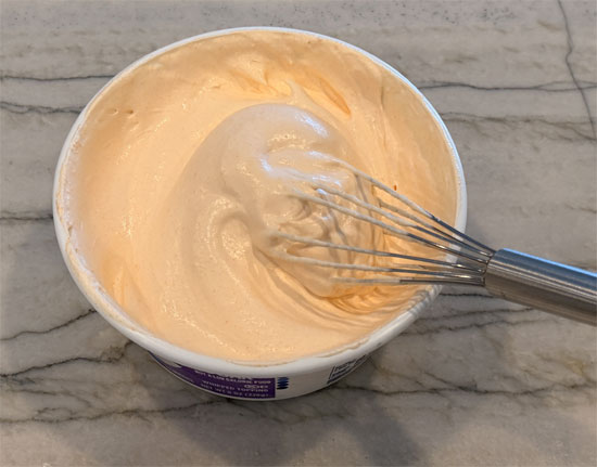Whisk the orange gelatin powder into the whipped topping until fully combined. Cover and refrigerate.