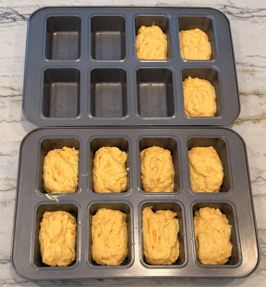 Divide the batter among the 11 mini-loaf tins, about 1/3 cup each.