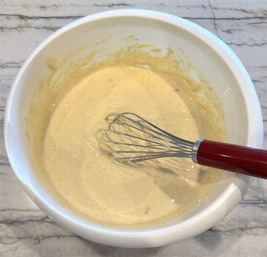Add the oat flour, cornmeal, and protein powder. Whisk until fully combined.