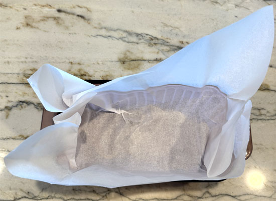 Line an 8 1/2 x 4 1/2 inch loaf pan with parchment paper.