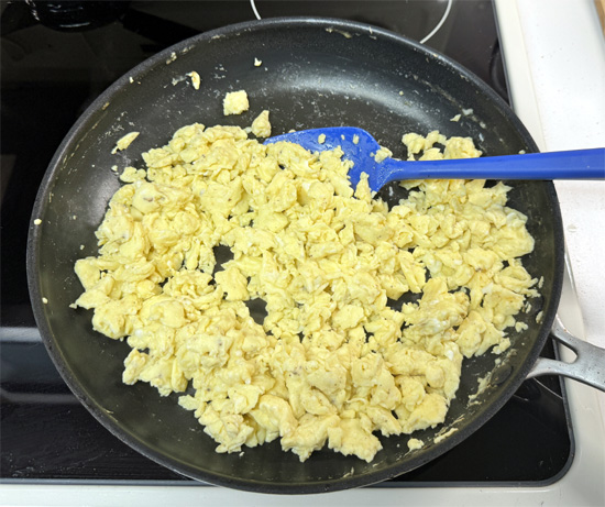 Pour in the eggs and cook, stirring constantly, for 5–6 minutes until scrambled and cooked through.