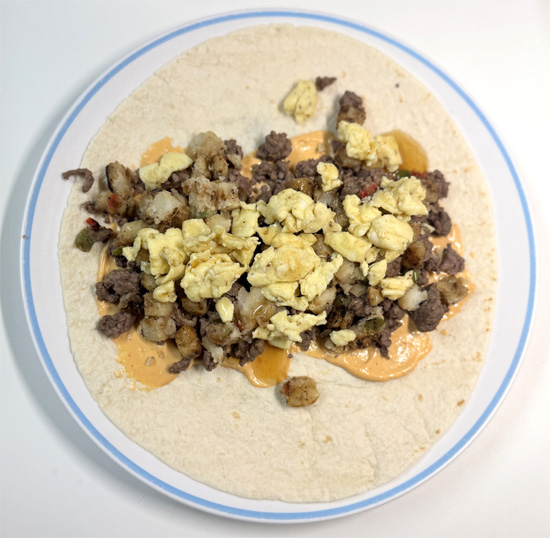 Drizzle 2 Tbsp sugar-free syrup over the filling of each burrito.