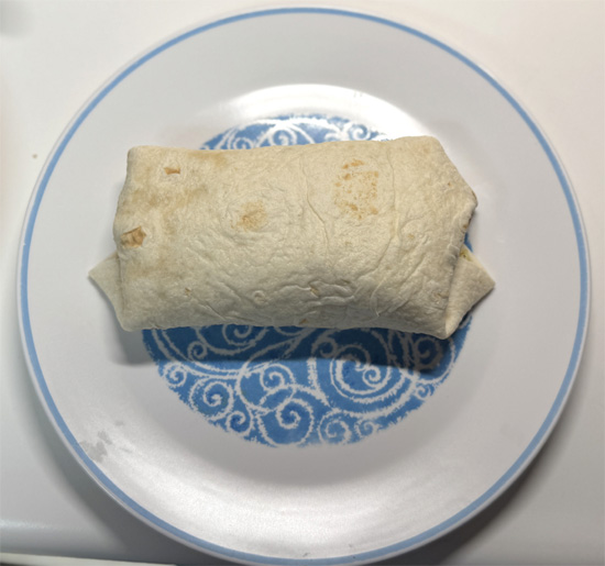 Fold up the bottom of the tortilla, then fold in the sides, and roll tightly.