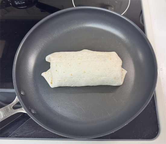 Heat a clean pan over medium heat. Place burritos seam-side down and toast for 2–2 1/2 minutes per side, until golden.