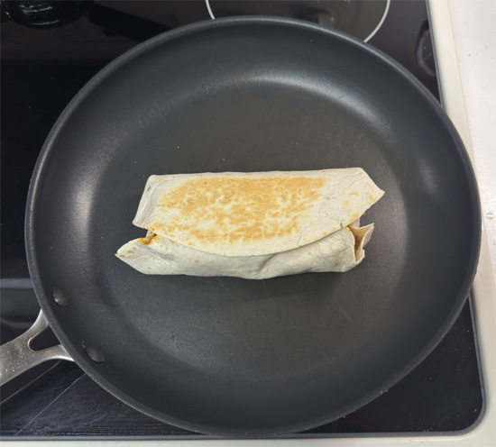 Heat a clean pan over medium heat. Place burritos seam-side down and toast for 2–2 1/2 minutes per side, until golden.