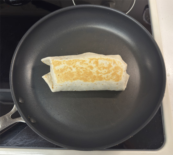 Heat a clean pan over medium heat. Place burritos seam-side down and toast for 2–2 1/2 minutes per side, until golden.