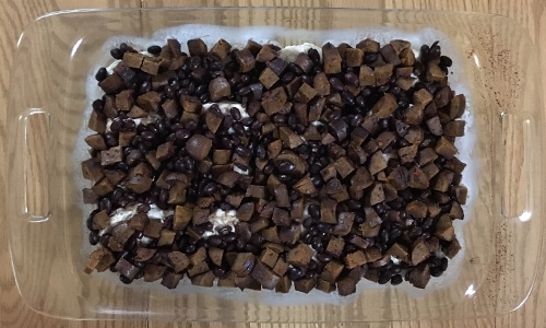 Black beans and sausage over the biscuits.