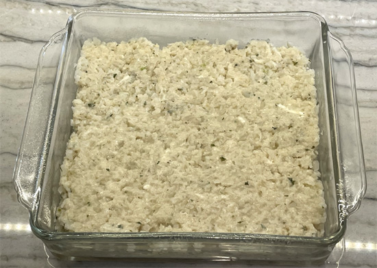 Spread the cauliflower flat in the 8x8 dish. 