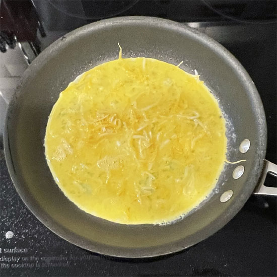 Egg and Meatless Sausage Burrito - Adding Cheese