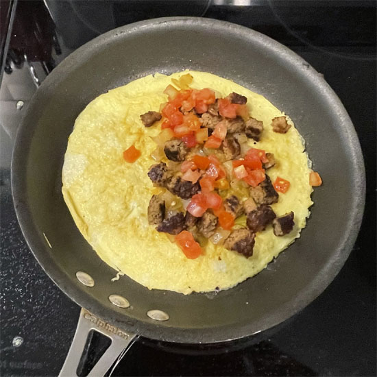 Egg and Meatless Sausage Burrito - Adding Tomatoes