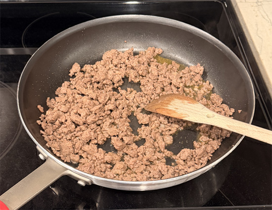 Heat a large skillet over medium heat. Add beef and sausage, breaking apart as it browns. Once no pink remains, transfer meat to the bowl with the bread. 