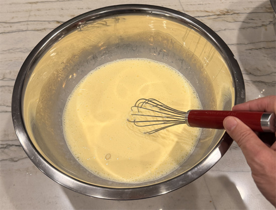 In a large bowl, whisk together egg whites, whole eggs, and half and half. 