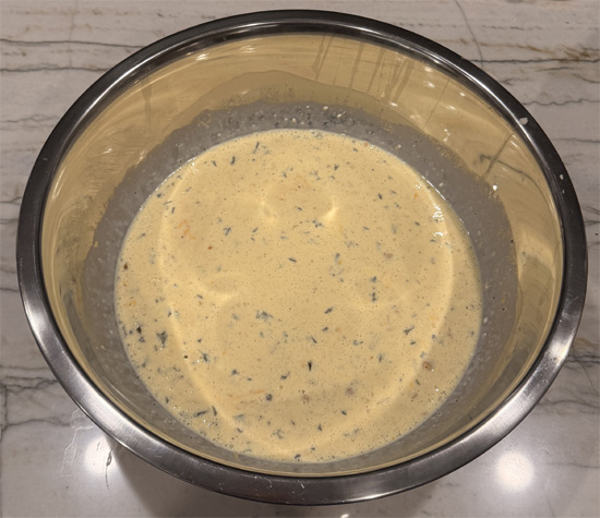 Stir cottage cheese into the egg mixture, then mix in both cheddar cheeses. 