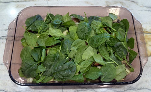 Spread the spinach evenly over top of the vegetables.