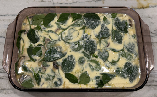 Pour the egg mixture over the top. Then cover and refrigerate until you're ready to bake.