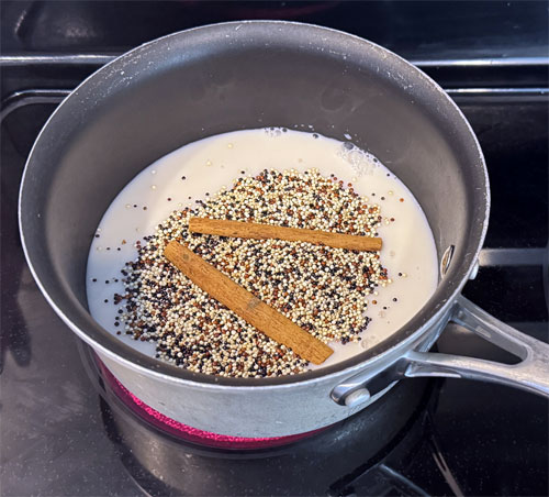 Put all the ingredients EXCEPT the syrup and peaches in a small saucepan. (Quinoa, almond milk, cinnamon sticks, vanilla extract and salt.) Bring to a high simmer, cover and reduce heat to low for 15 minutes.