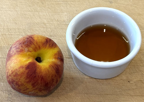 Mix one tablespoon of the sugar free syrup into each bowl (or adjust to your preference) and top each one with half a sliced peach. If you want it more like a porridge, you can pour extra warmed almond milk over the top. 