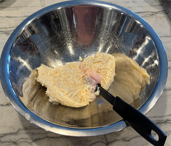 While crust bakes, cook sausage in a non-stick pan over medium-high heat for 5-7 minutes until lightly browned. Transfer sausage to the cheese mixture and stir to combine. Reserve the grease in the pan.