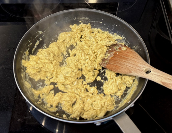 Heat the pan again over medium-high heat and spray with olive oil. Scramble the seasoned eggs until soft set.