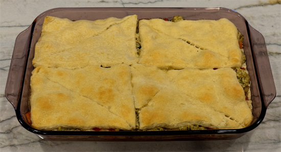 Unroll second tube of crescent rolls over the top. Bake 12-16 minutes until golden brown.