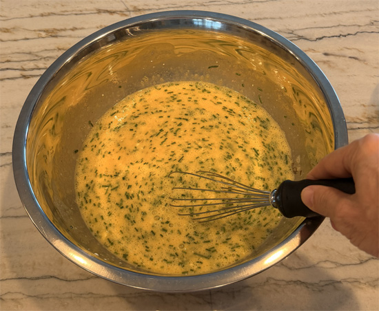 Whisk together the eggs, egg whites, cottage cheese, salt, pepper, and garlic powder until smooth. A blender works well for this. Stir in the chives and shredded cheese. Set aside.