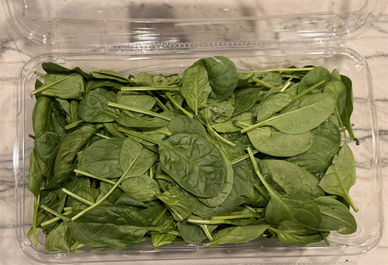 Heat a large skillet over medium heat and spray lightly with olive oil. Cook the spinach in batches until wilted. Transfer to a bowl and set aside.