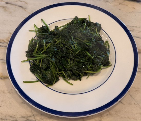 Heat a large skillet over medium heat and spray lightly with olive oil. Cook the spinach in batches until wilted. Transfer to a bowl and set aside.