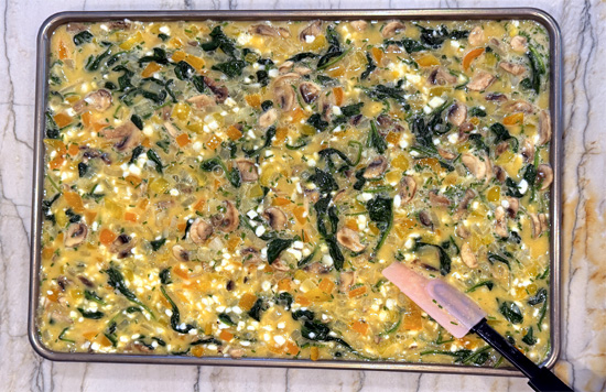 Pour everything into the prepared pan and sprinkle cheese over the top. Bake 18 to 22 minutes, until the center is set.