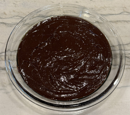 Lightly spray a 9-inch pie plate with avocado oil. Then fill with the brownie mix. 