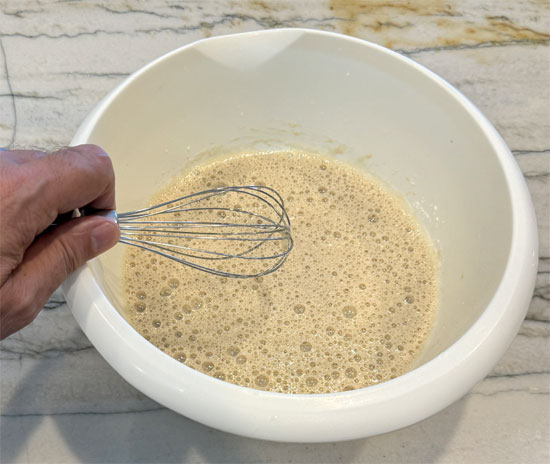 While the eggs are sitting, whisk together the next four ingredients: milk, brown sugar replacement, Splenda and vanilla. Then, whisk in the cocoa and set aside.