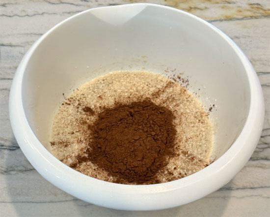 While the eggs are sitting, whisk together the next four ingredients: milk, brown sugar replacement, Splenda and vanilla. Then, whisk in the cocoa and set aside.