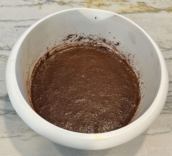 While the eggs are sitting, whisk together the next four ingredients: milk, brown sugar replacement, Splenda and vanilla. Then, whisk in the cocoa and set aside.