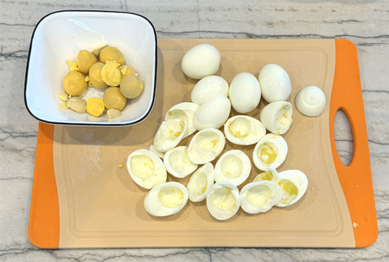 Cut 8 of the eggs in half and remove the yolk. Leave 4 eggs with the yolk.
