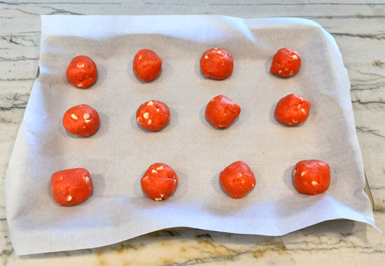 Scoop out about 1/4 cup of dough for each cookie (a large cookie scoop or your hands work well). Roll each portion into a ball and arrange them evenly on your prepared baking sheet. You should get 14 cookies. 