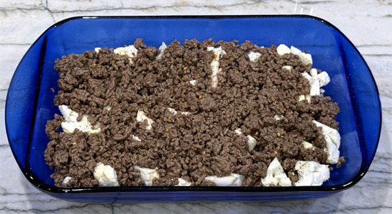 Layer the cooked ground beef over the cauliflower.