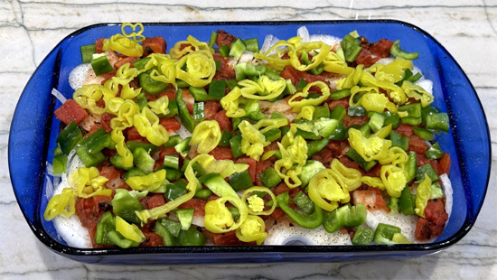 Top with the sliced pepperoncini, distributing them evenly across the casserole.