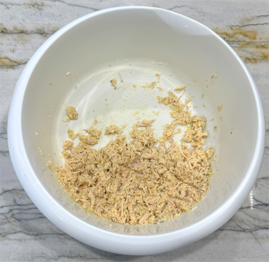 Mix together the first seven ingredients, chicken, parmesan, garlic, oregano, rosemary, red pepper and egg. Make sure it's thoroughly combined. 