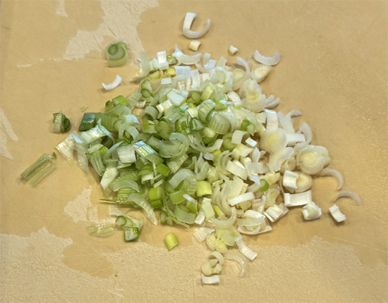Sprinkle the shredded reduced-fat cheddar cheese AND the green onions over the pasta. Then, cover the skillet to allow the things to melt together for about 3-5 minutes.