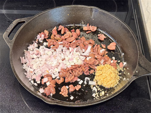 Sauté Aromatics: Reduce heat to medium-low. Add olives, garlic, shallots, and the remaining spice mix to the pan. Cook for 2-3 minutes until fragrant, scraping up any browned bits from the pan.