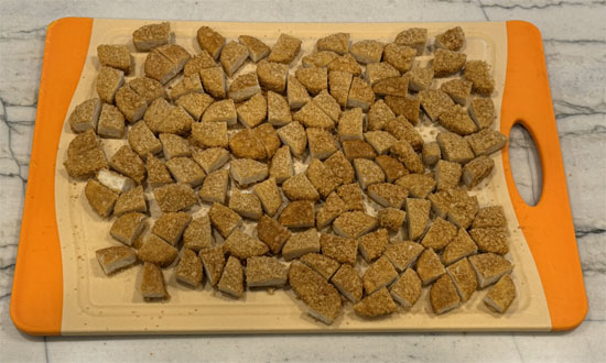 Cut the frozen Chick'n nuggets into quarters. 