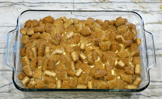 Put the covered dish in the oven and bake at 350 degrees Fahrenheit for 30 minutes. Then, remove the aluminum and bake for another 30 minutes, until the eggs are set and the top is golden brown. (Your total bake time is one hour.)