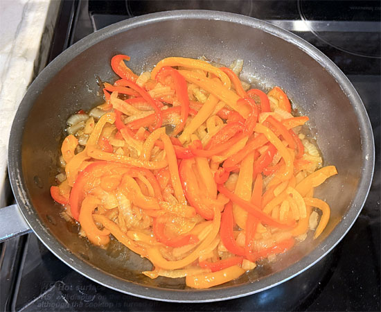 Stir in the sweet chili sauce, then cover and cook for another 4 to 6 minutes, stirring occasionally, until the peppers soften.