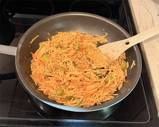 About 10-20 minutes before chicken is done, prepare noodles according to package directions. Set aside.