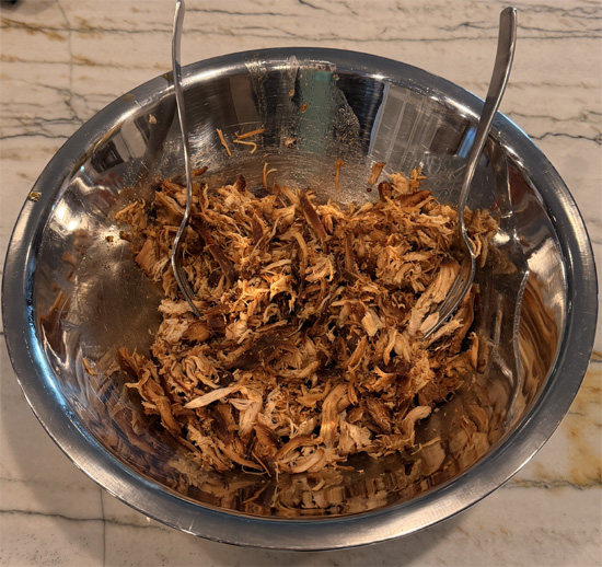 Transfer chicken to a cutting board and shred with two forks.